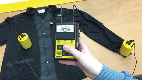 Checking an ESD lab coat using a surface resistance tester