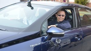 Researcher Yushan Yan, at the wheel of a fuel cell vehicle, is conducting research on the use of nickel as a catalyst in an alkaline electrolyte that promises to bring down the cost of hydrogen fuel cells.